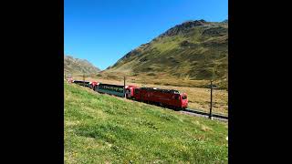 Glacier Express at Oberalp Pass in Swiss Alps Matterhorn Gotthard Bahn [upl. by Ajnin]