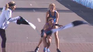 Stranger Carries Woman to Marathon Finish Line [upl. by Doomham]