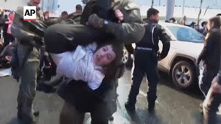 Police forcibly remove ultraOrthodox men blocking Jerusalem street over potential new draft law [upl. by Marlea]