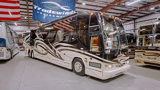 Sold TRAVEL IN LUXURY  Tour this 2009 Prevost Liberty H334 Triple Slide Coach [upl. by Rapsag472]