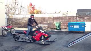 Loading long track snowmobile into short bed truck [upl. by Herod]