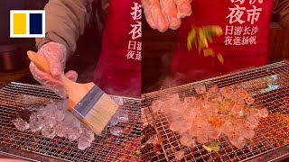 Grilled ice cubes become popular street food in China [upl. by Roselane]