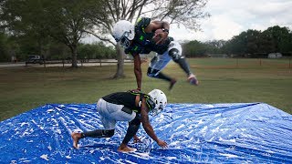 PLAYING TACKLE FOOTBALL ON A SLIP AND SLIDE PT 2 [upl. by Eiramyelhsa383]