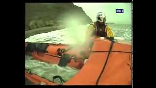 Two people stranded by tide helped by Whitby lifeboat [upl. by Auqinehs]