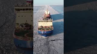 Icebreaker ship clearing icy water for other cargo ships [upl. by Nare]