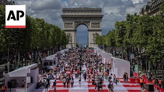 The ChampsÉlysées in Paris is transformed into a massive table for a special picnic [upl. by Ecarg]