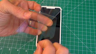 How to PERFECTLY apply TEMPERED GLASS SCREEN PROTECTOR on your Phone  Tempered Glass Installation [upl. by Eirotal]