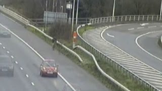 Cyclist caught riding bike on busy motorway in Surrey [upl. by Colman261]