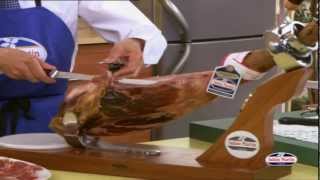 How to Carve Iberico Ham from wwwfoodsofspaincouk  Spanish Food Online [upl. by Roobbie]