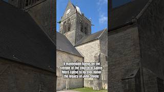 A mannequin hangs on the steeple of the church in SainteMereEglise to forever honor John Steele [upl. by Dru]