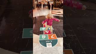 At the mall Maya plays hopscotch gameВ торговом центре Майя играет в игру quotклассикиquot shorts [upl. by Lemal]