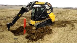 Skid Steer E Z Digger Backhoe Stiff Arm Attachment From Spartan Equipment [upl. by Ajssatsan109]