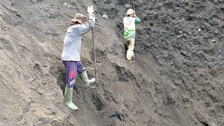 amazing teamwork 2 miners digging black sand on a cliff [upl. by Innattirb157]