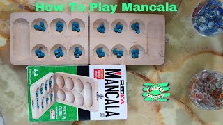 Mancala Explanation How to play Mancala  كيف تلعب المنقلة [upl. by Nomelif]