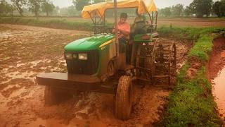 John Deere 5055e  puddling with double cage wheel  5310 [upl. by Anisamot66]