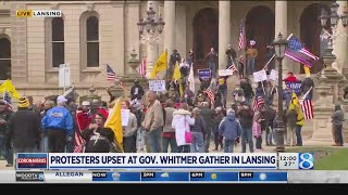 Protesters in opposition of stayhome order gather at Michigan capitol [upl. by Ready]