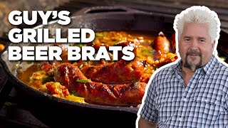 Guy Fieris Grilled Beer Brats with Peppers and Onions  Guys Big Bite  Food Network [upl. by Nylsaj]