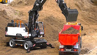 Huge RC Construction Site Wheel Excavator Trucks Fire Engines  Modellbaumesse Friedrichshafen 2024 [upl. by Goda]