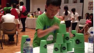 A pupil from Sengkang Green Primary School practising at a cup stacking competition [upl. by Ssej960]