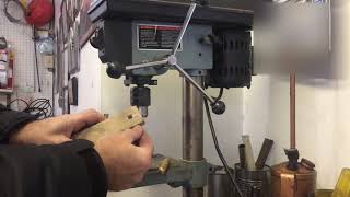 How to drill a centered hole in a metal shaft for a cotter pin [upl. by Pickar]