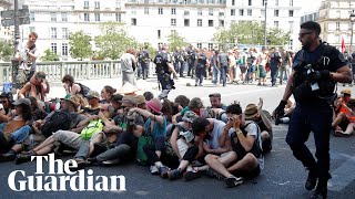 Police use pepper spray on seated climate protesters in Paris [upl. by Constance]