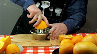 Freshly squeezed orange juice A man makes orange juice from fresh fruit [upl. by Giesser]