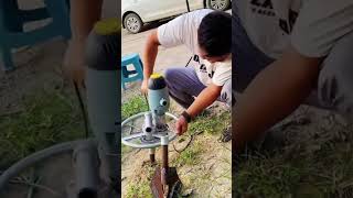 Handheld spiral ground anchor installation drill [upl. by Nissy]