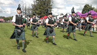 Pipe Major Cooper leads Ballater Pipe Band on the march during 2023 Dufftown Highland Games [upl. by Salocin531]