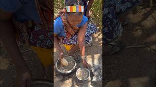 Hadza woman preparing food for the family hadzabe africa [upl. by Tillfourd]