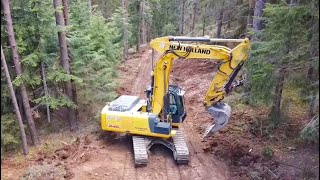 realizzazione STRADA FORESTALE con escavatore NEW HOLLAND E245 [upl. by Akiemaj916]