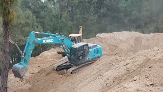 Excavator and JCB Backhoe Loader Throwing Out Dusty Soil From Hilly Road Hilly Road Construction [upl. by Ddart666]