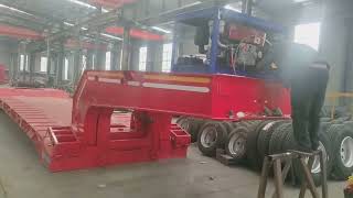 2line 4axle low bed trailer 100ton pressure test successfulShanghai Trailer low bed trailer [upl. by Ahseniuq]