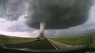 Storm chasing dashcam Tornado crossing the highway Laramie Wyoming [upl. by Aihsemat]