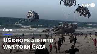 US drops aid into wartorn Gaza  AFP [upl. by Eiramadnil]