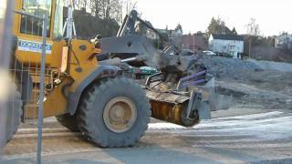 Volvo L110E with Holms sweeper working on a construction site [upl. by Suivatram532]