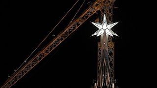 Giant star illuminates Barcelona skyline on inauguration of Sagrada Familia tower [upl. by Pimbley]