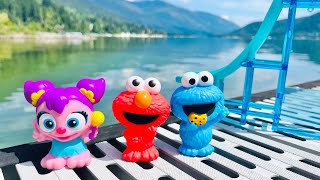 LAKE JUMP Waterslide Fun Videos with Seseme Street Toys Elmo ABBY CADABBY and Cookie Monster [upl. by Carine]