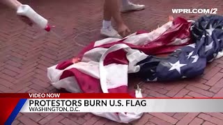 Video Now Protestors burn US Flag in Washington DC [upl. by Faunie]