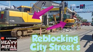 excavator  Reblocking city streets [upl. by Levesque]