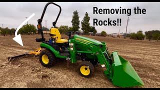 John Deere 1025R  Raking Rocks and Scooping Dry Grass [upl. by Ailbert]