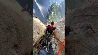 Walk the thrilling iron path on Mount Huashan cliffside [upl. by Nefets]