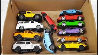 Box full of various miniature cars Peugeot Jaguar Pagani Hyundai Cadillac One Opel DHL [upl. by Ahsiek850]