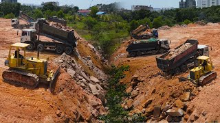 Nice Team Work Filling Land by Operator Bulldozer Spreading Stone and many Dump Truck Loading Stone [upl. by Slayton182]