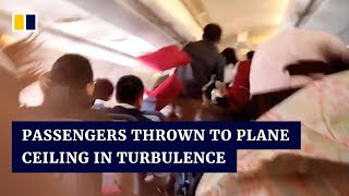 Passengers in China thrown to plane ceiling in turbulence [upl. by Nikita886]