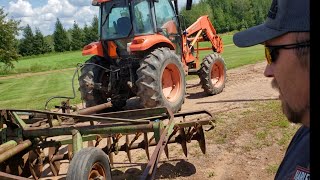 Kubota M6040 and John Deere 13 ft Disc First Run [upl. by Nhguahs]