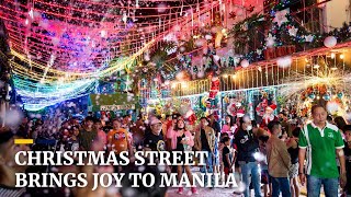 Street in Philippine capital transformed into Christmas wonderland with Santas and snowfall [upl. by Anawk328]