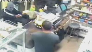 Brave store clerk uses machete to fight off armed robber in New York [upl. by Platto188]