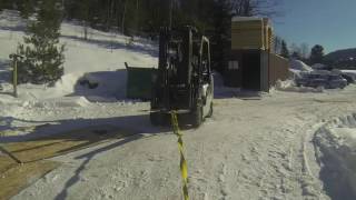 Forklift stuck in snow Ford focus tries to pull strap breaks [upl. by Nevs684]