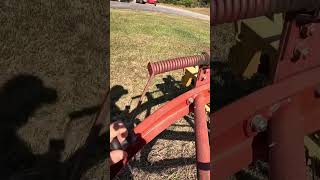 Raking hay with a 256 rolabar hay rake farming [upl. by Nywg]