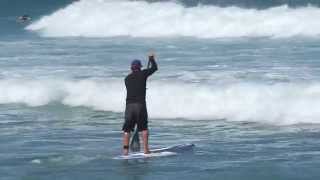 SUP Surf Instruction  How to Paddle Through Breaking Waves [upl. by Sirronal697]